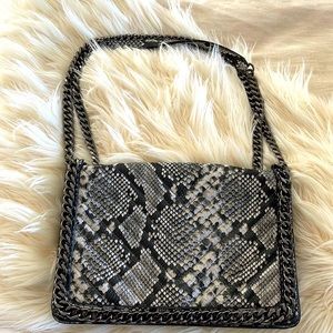 Aldo Greenwald
Crossbody bag.  New Berber been used.